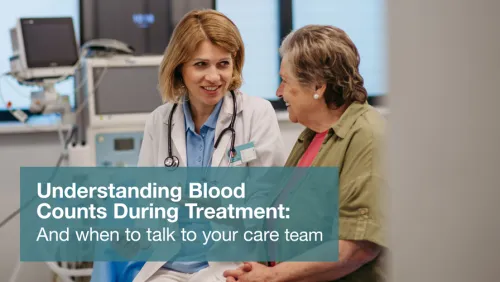 Doctor and patient talking in a medical office, both smiling.